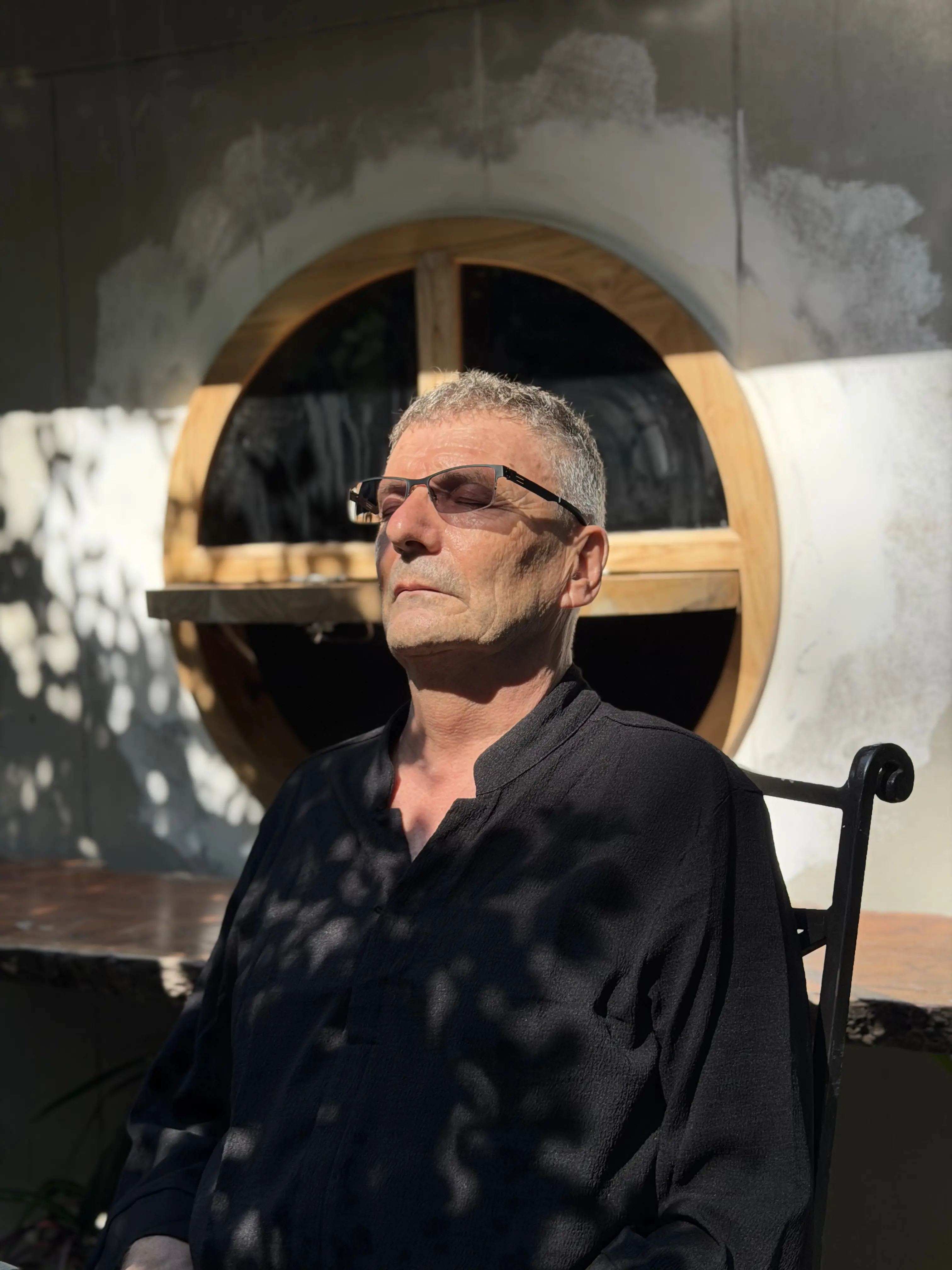 A guest meditating in the courtyard at Zen Pod, Bang Sare
