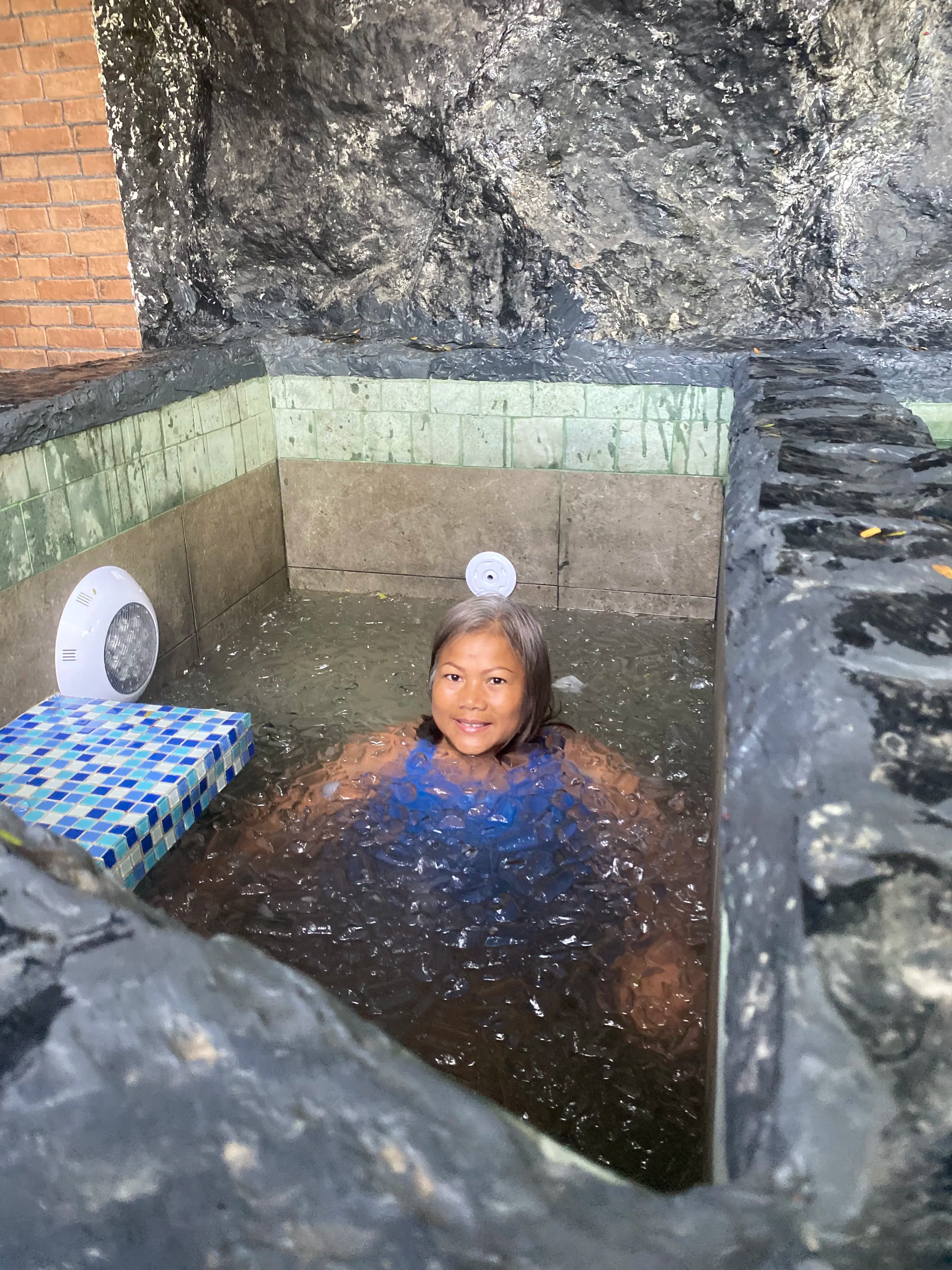 A guest in the ice bath cold plunge at Zen Pod, Bang Sare