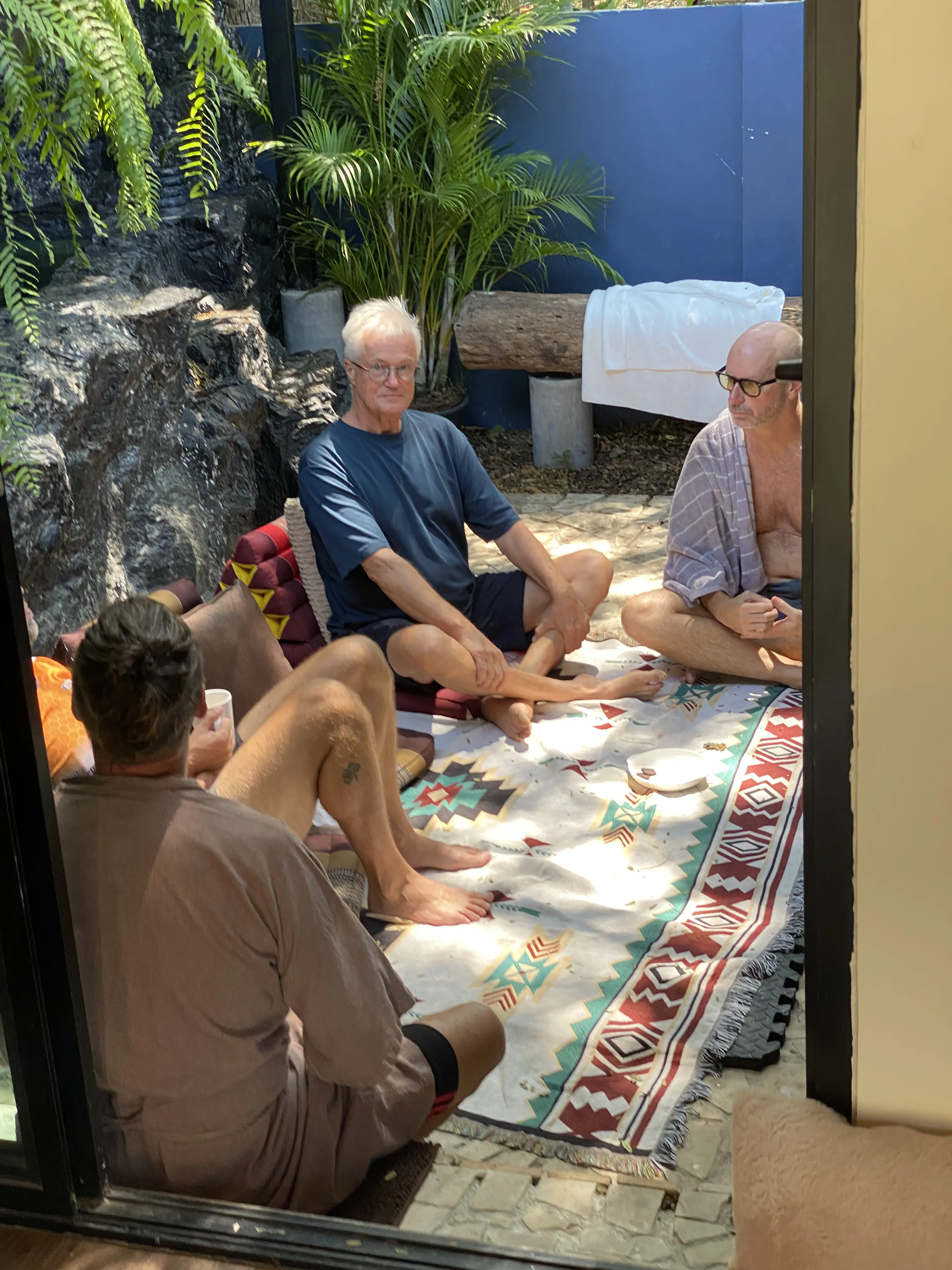 Guests relaxing in the outdoor lounge circle at Zen Pod, Bang Sare